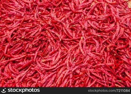 Dried red hot chilli pepper close up background