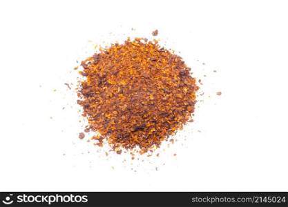 Dried red pepper flakes, isolated on white.. Dried red pepper flakes