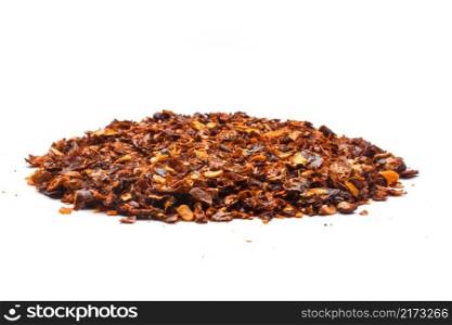 Dried red pepper flakes, isolated on white.. Dried red pepper flakes