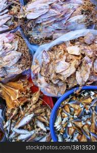 Dried shredded squid, seafood product, made from squid or cuttlefish, commonly found in coastal Asian, show at Vietnam open air market, is popular street snack