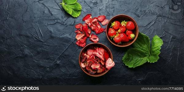 Dried summer berry,fruit dessert.Strawberry chips,berry sweetness in bowl. Dried strawberry slices