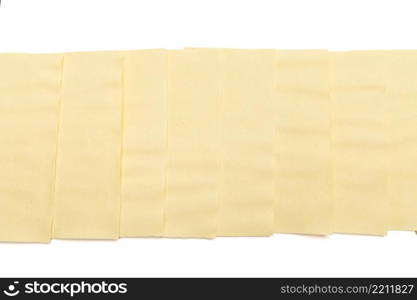 dried uncooked lasagna pasta sheets isolated over the white background. dried uncooked lasagna pasta sheets