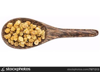 dried white mulberries on a wooden spoon isolated on white - superfruit