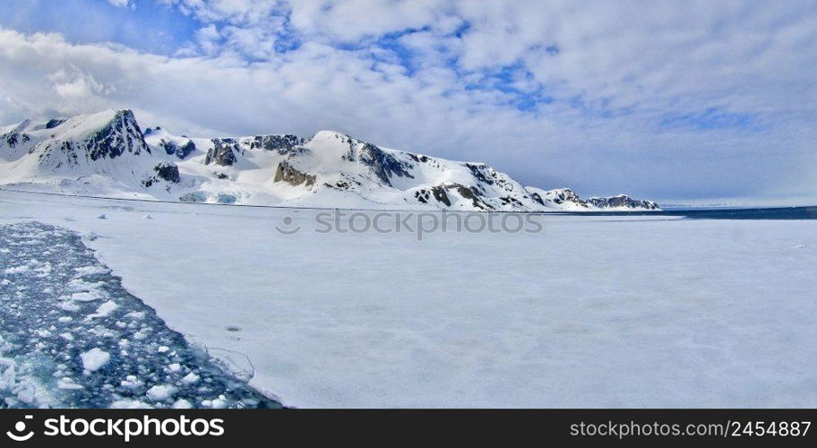 Drift floating Ice and Snowcapped Mountains, Albert I Land, Arctic, Spitsbergen, Svalbard, Norway, Europe