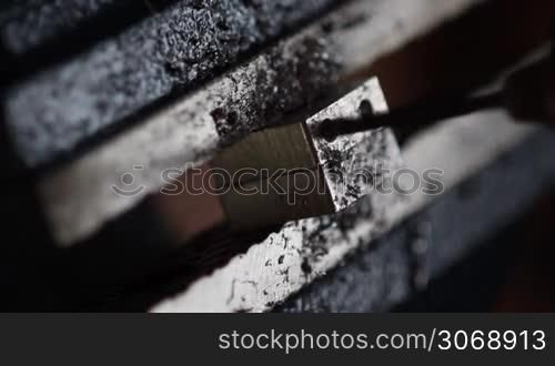 drill machine creates precise hole in metal block