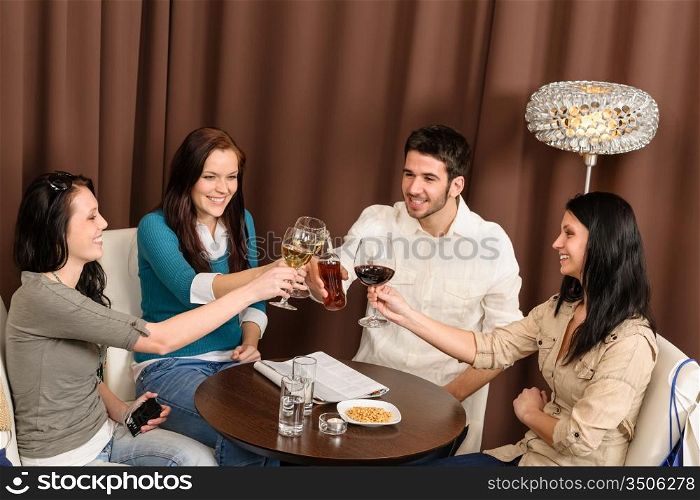 Drink after work happy friends toasting at bar have fun