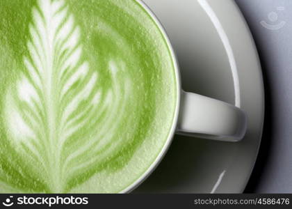 drink, diet, weight-loss and slimming concept - close up of matcha green tea latte in cup