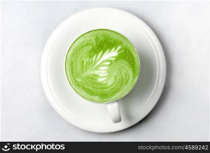 drink, diet, weight-loss and slimming concept - cup of matcha green tea latte over white