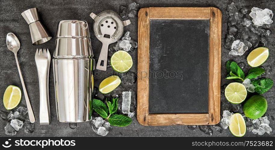 Drink making tools and ingredients for cocktail. Lime and mint leaves. Blackboard for recipe text