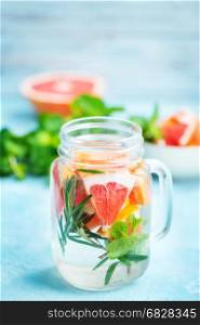 drink with grapefruit, fresh rosemary and ice