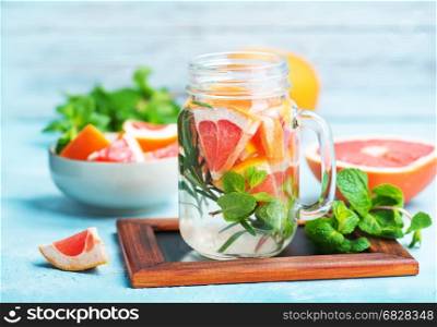 drink with grapefruit, fresh rosemary and ice