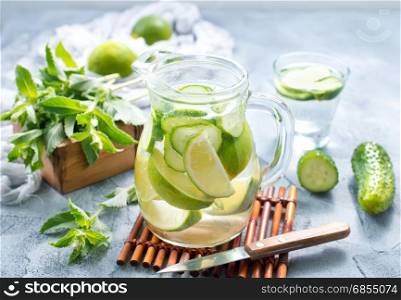 drink with lemon and cucumber in the jug