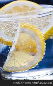 Drink with lemon, close up photo