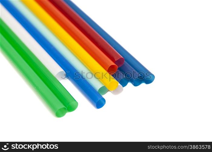 Drinking differently shaped colorful straws isolated over white background