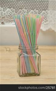 Drinking straws in a bottle