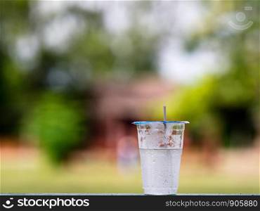 Drinking water cup with nature background.