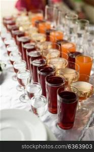 drinks in cups and glasses on the table, buffet