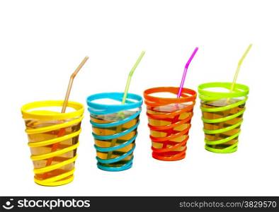 drinks in glasses with red yellow green and blue color with straw