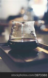 drip coffee in cafe, vintage filter image