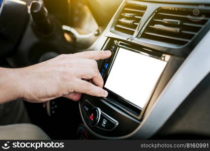 Driver hands changing the radio station. Close up of hands changing the car radio station. Concept of driver tuning the radio. Driver man changing radio station