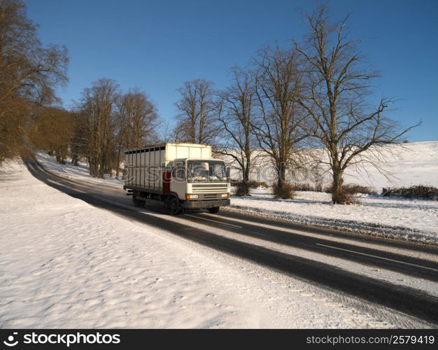 Driving a truck on a rural road in winter in the United Kingdom.