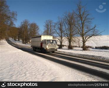 Driving a truck on a rural road in winter in the United Kingdom.