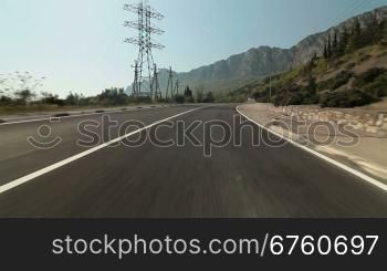 Driving car on a mountain road along the coast of the Black Sea. Yalta, Crimea