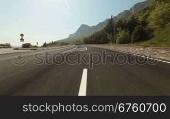 Driving car on coastal mountain road in direction of Yalta - Sevastopol
