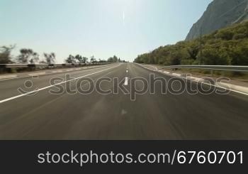 Driving car on coastal mountain road in direction of Yalta - Sevastopol