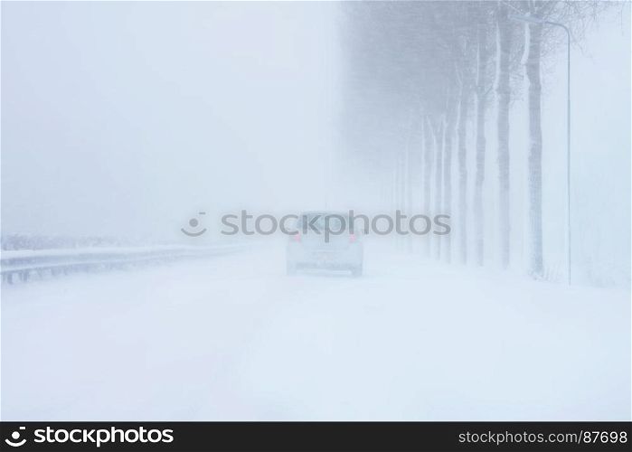 Driving in a severe snow storm in winter in the Netherlands