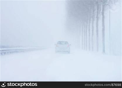 Driving in a severe snow storm in winter in the Netherlands