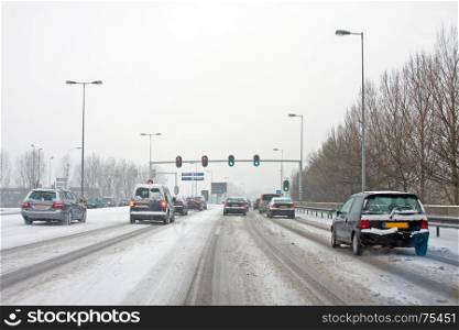 Driving in a severe snowstorm in Amsterdam in winter in the Netherlands