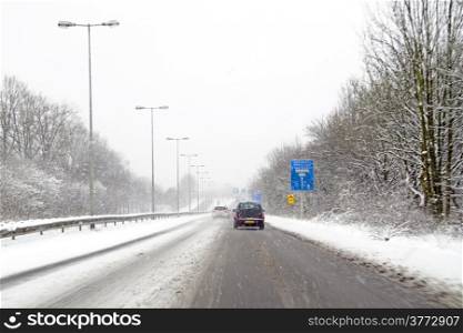 Driving in a snowstorm in Amsterdam the Netherlands