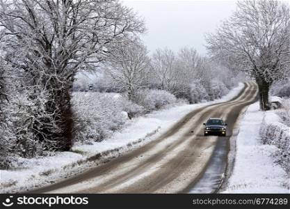 Driving in winter snow on a country road in North Yorkshire in the United Kingdom