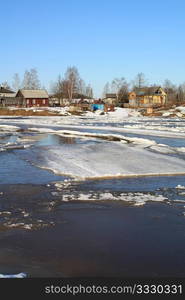 driving of ice on river near villages