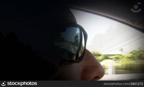 Driving,traffic reflection on the sunglasses,side door window reflection