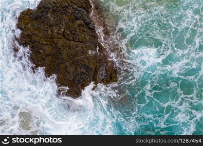 Drone aerial view of waves crashing over rocks on Lumaha&rsquo;i beach on north shore of Kauai. Vertical top down view of waves crashing over rocks on Lumahai beach on Kauai