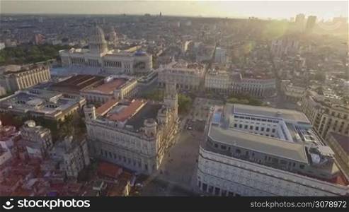 Drone flying over Old Havana, Cuba: Capitolio monument and Habana Vieja district. Aerial view of La Habana, Cuban capital city. Urban landscape from the sky with buildings, homes, houses, landmarks.
