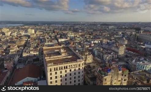 Drone flying over Old Havana, Cuba: Habana Vieja district. Aerial view of La Habana, Cuban capital city. Urban landscape seen from the sky with buildings, homes, houses, monuments. Travel destination.