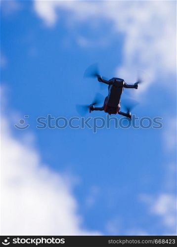 Drone flying over sky background, take a photo and video. Drone flying over sky background