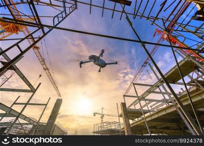 Drone over construction site. video surveillance or industrial inspection 