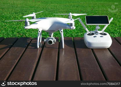 drone quad copter with high resolution digital camera and its remote control pad with smartphone