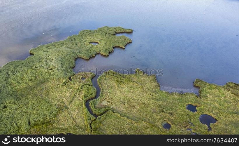 Drone top down bird&rsquo;s eye view landscape image of tidal wetlands in Christchurch Harbour on England&rsquo;s South Coast