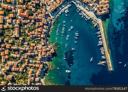 Drone View on a Beach Bay. Aerial View of a Coastal City with Red Roofs near Yacht Harbor. Luxury Summer Vacation in Dubrovnik. Croatia.. Costal View of Dubrovnik. Croatia.