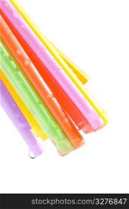 drops and bunch of colorful straws with white background.