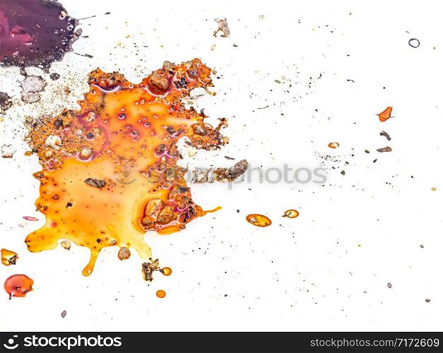 Drops of color on a white background with sand and soil.