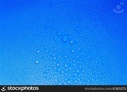 Drops of the fresh water on light blue background