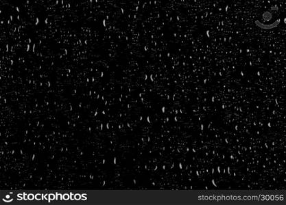 Drops of water on a dark glass texture background