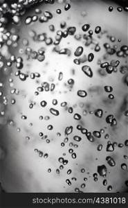 drops of water on glass with black boundaries macro shot
