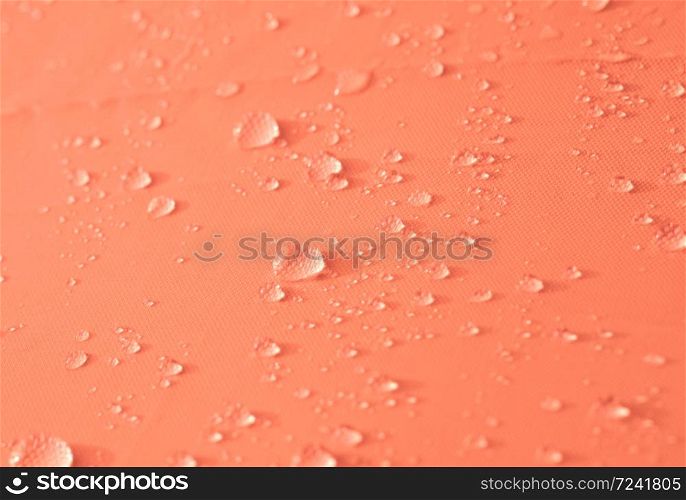 Drops of water or rain drop on orange background.